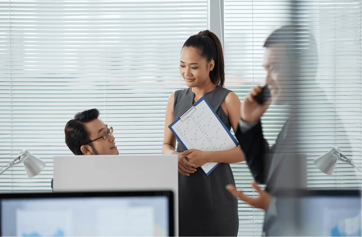 Chinese software engineers collaborating in office
